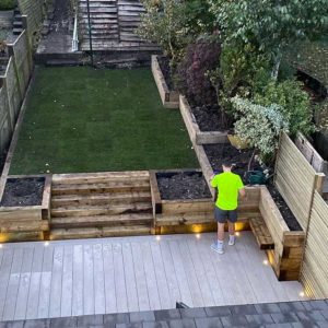 Limed Oak Millboard Decking with Sleepers and privacy trellis - Surrey ...